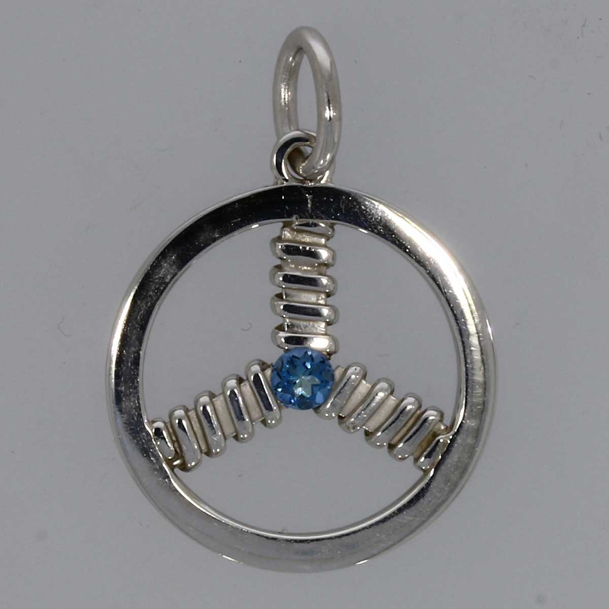 A sterling silver pendant with aquamarine gem.